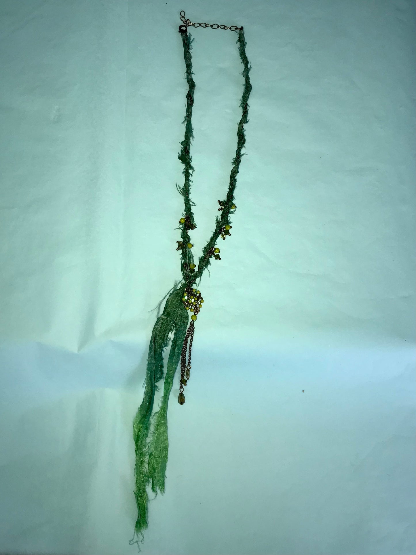 Mermaid recycled necklaces wrapped in sari silk remnants.