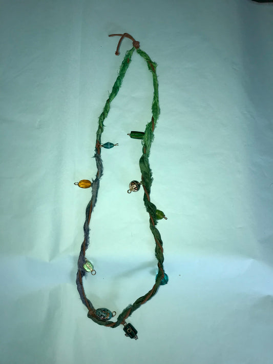 Mermaid recycled necklaces wrapped in sari silk remnants.